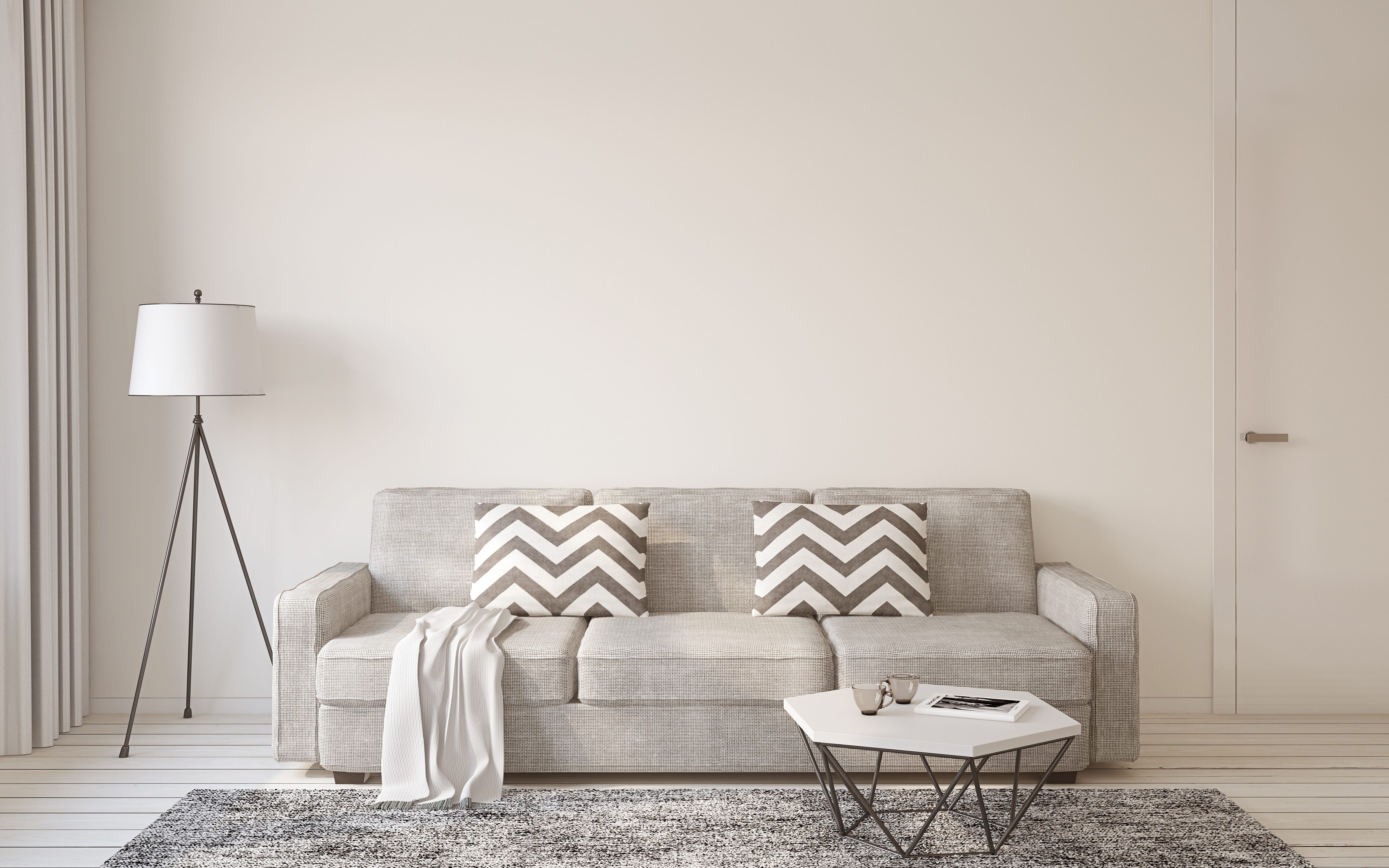 graue Wand und graue Couch