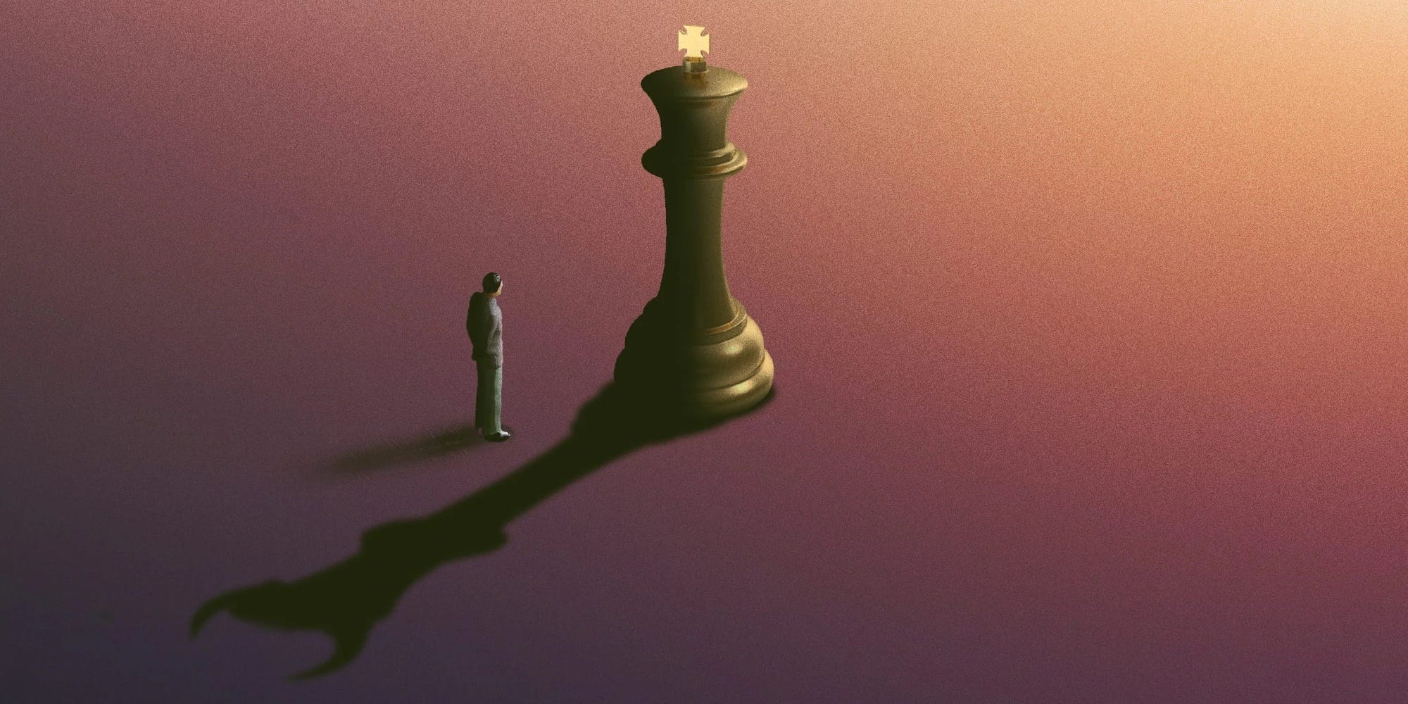 Person steht im Schatten einer Schachfigur