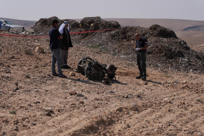 In front of the booster of a rocket which, according to Israeli authorities, seriously injured a 7-year-old girl, near Arad (Israel), on April 14, 2024. 