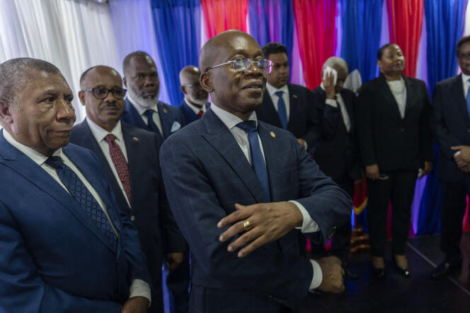Interim Prime Minister Michel Patrick Boisvert, center, surrounded by members of the transition council during an installation ceremony, in Port-au-Prince, Haiti, April 25, 2024. 
