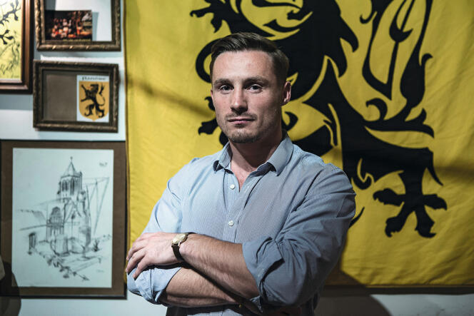 Aurélien Verhassel, president of the small identity group La Citadelle, photographed in 2016 in front of a flag of Flanders, during the opening of his private club.