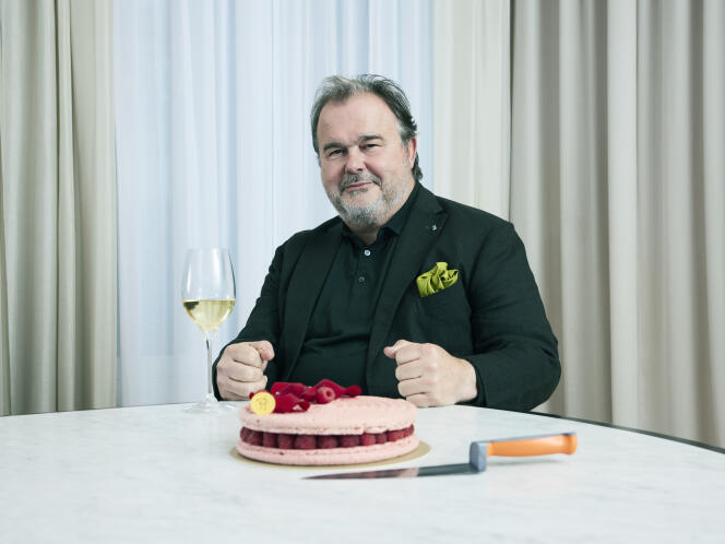 Pierre Hermé with a glass of gewurztraminer and an Ispahan cake, in his offices, April 11.