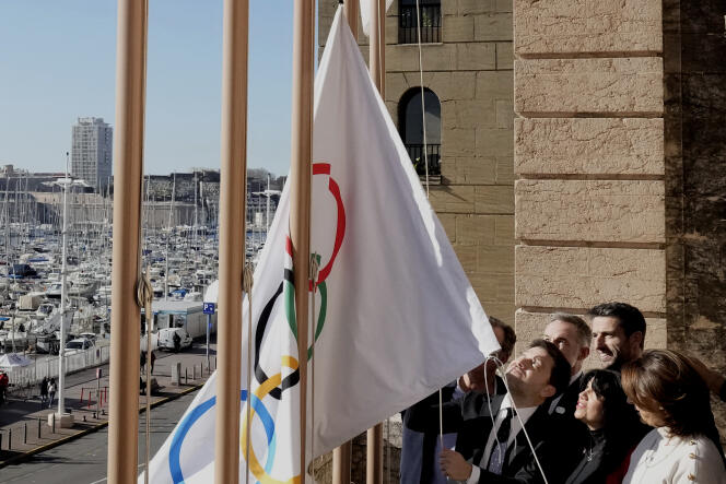 The mayor of Marseille, Benoît Payan, hoists the Olympic flag at Marseille city hall, February 3, 2023. 
