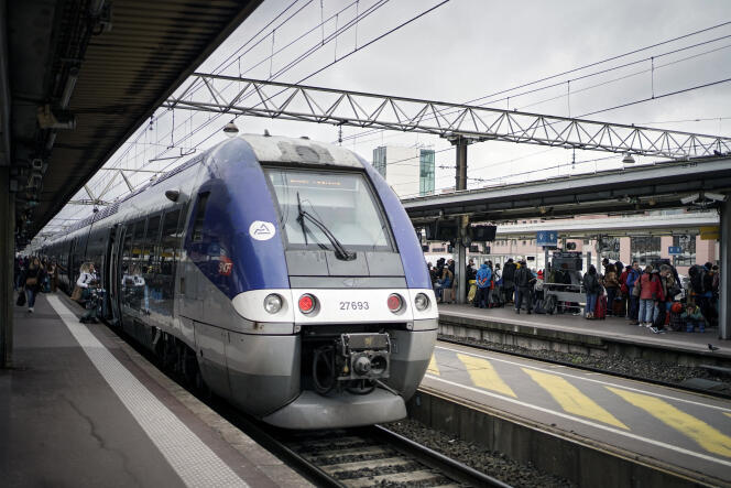 Passengers wait for a train in Lyon, February 17, 2024.