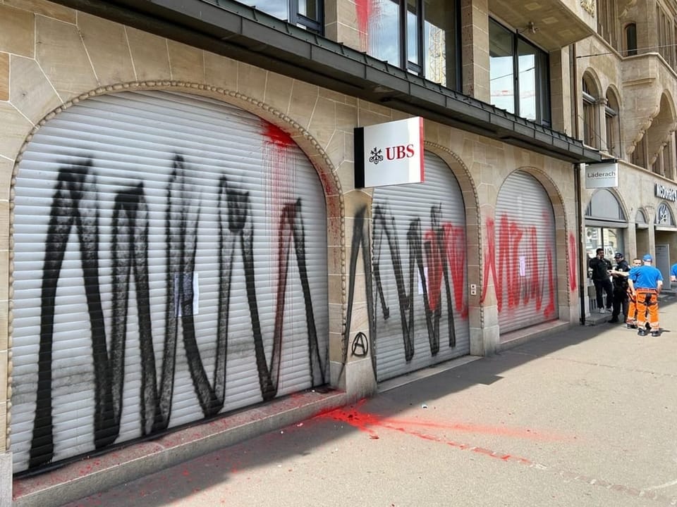 In Zurich and here in Basel, UBS branches were smeared with spray paint.