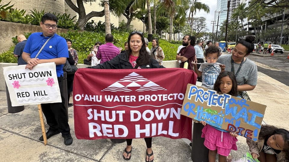 Protesters with banners protecting water in O'ahu demand closure of Red Hill.