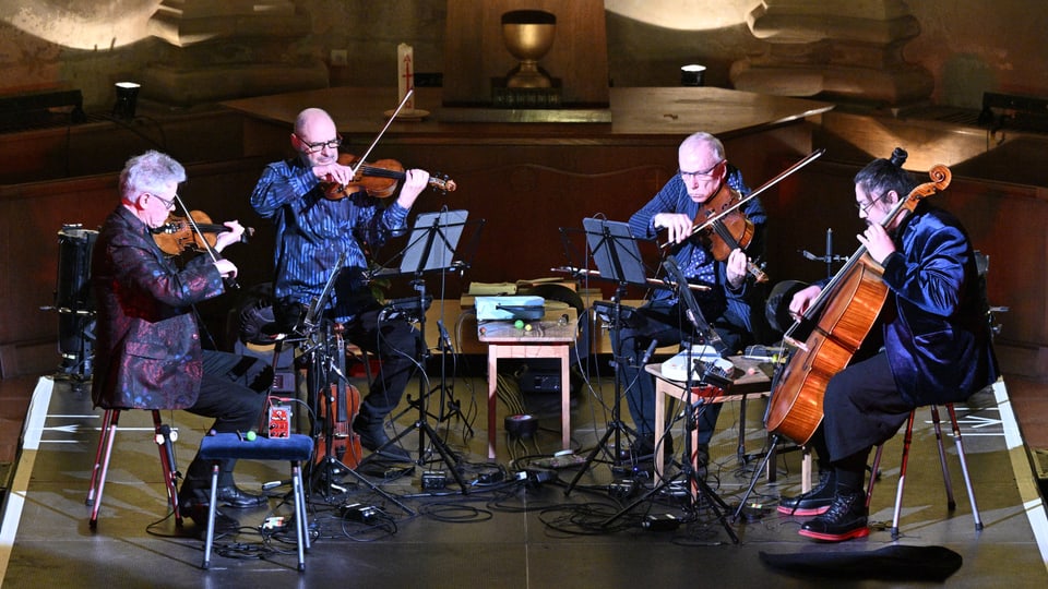 String quartet makes music live on a stage.