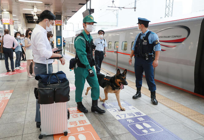 Police patrol on a platform at Tokyo station, September 2022.