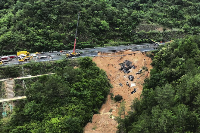 Rescue workers intervene on a collapsed part of a highway, in Meizhou (China), May 2, 2024.