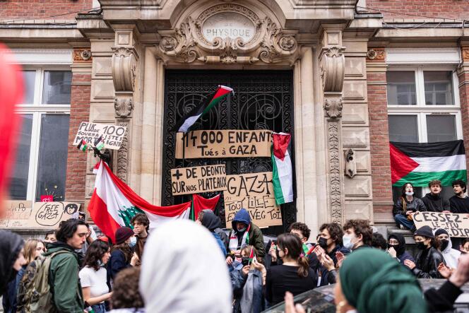 Students block the entrance to the Higher School of Journalism during a pro-Palestinian solidarity demonstration, in Lille, May 2, 2024.