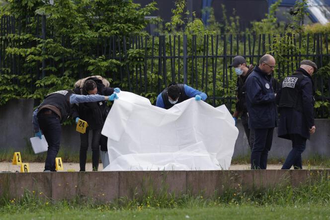 Judicial police officers examine the scene where two men were shot dead, in Sevran, in Seine-Saint-Denis, on May 5, 2024.