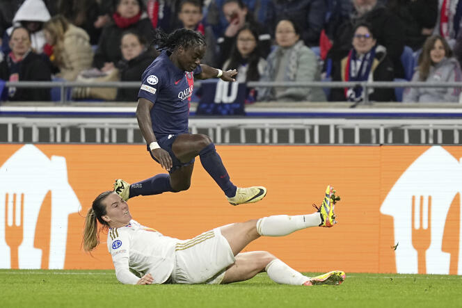 Tabitha Chawinga escapes the tackle of Lyon defender Vanessa Gilles, in the semi-finals of the Champions League. 