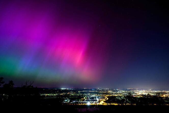 Northern lights light up the night sky over Vienna, Austria, during a geomagnetic storm, May 11, 2024.