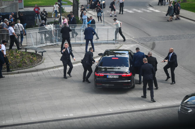 Security officers usher Slovak Prime Minister Robert Fico into a car after gunfire, in Handlova, Slovakia, May 15, 2024.
