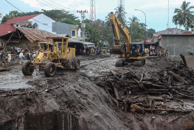 Machines clear mud and debris after deadly flash floods and a cold lava flow in Tanah Datar, on the island of Sumatra in Indonesia, May 13, 2024.
