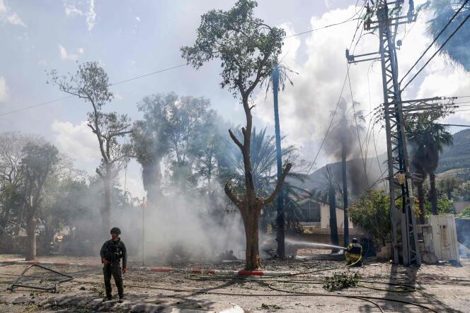 Security forces and emergency personnel deploy to a site hit by rockets fired from southern Lebanon in the northern Israeli town of Kiryat Shmona near the Lebanese border, May 5, 2024.