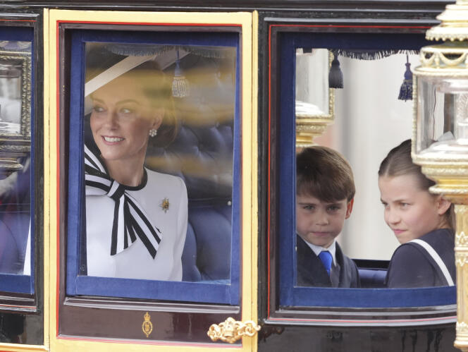The Princess of Wales and her children, Louis and Charlotte, board the carriage which takes them to Horse Guards Parade, in London, June 15, 2024. 